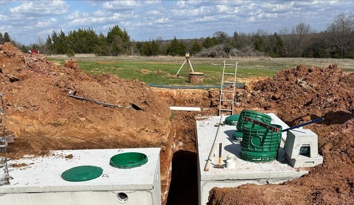 Concrete septic tanks in excavation