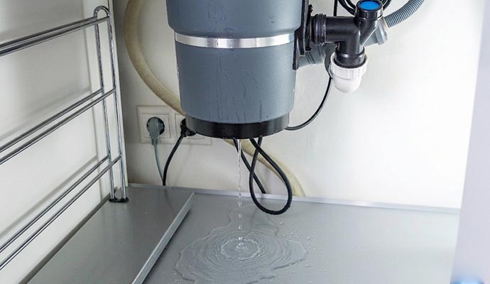Garbage disposal leaning water