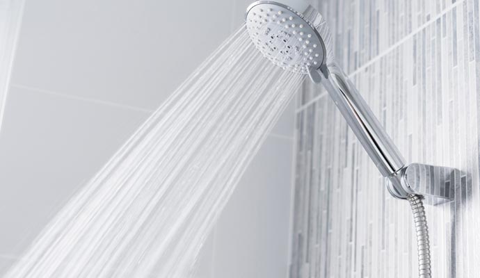 Handheld shower head mounted on a wall