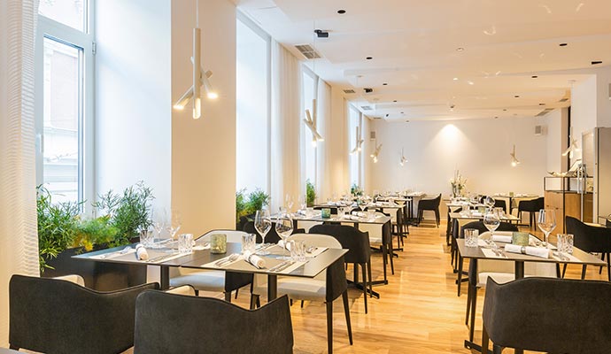 Restaurant dining room set up with lighting and tables