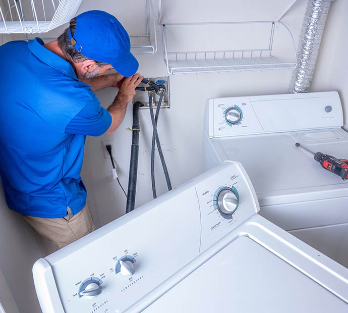 Technician installing washing machine
