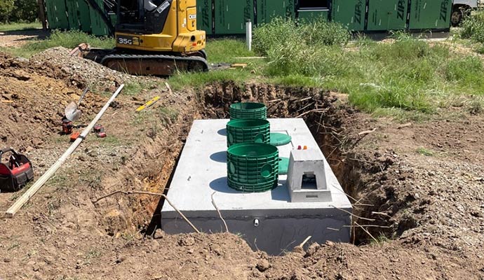 Installation of a concrete septic tank system