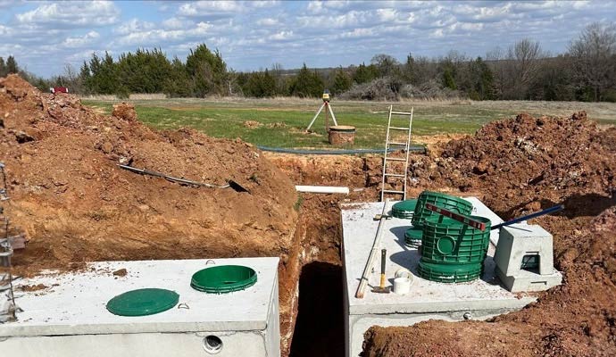 Precast concrete septic system installation in progress