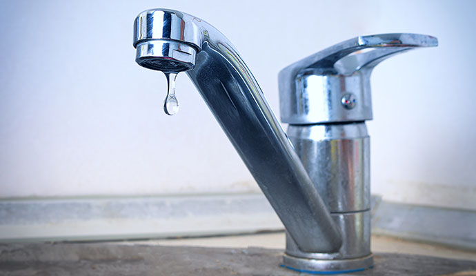 Water dripping from bathroom faucet