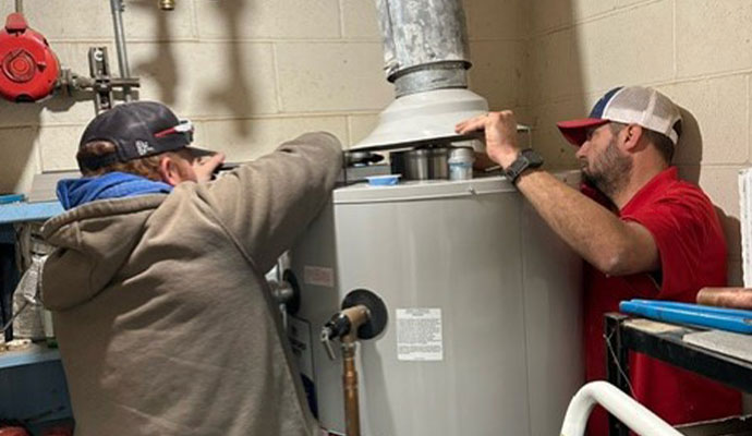 Water heater installation service in progress